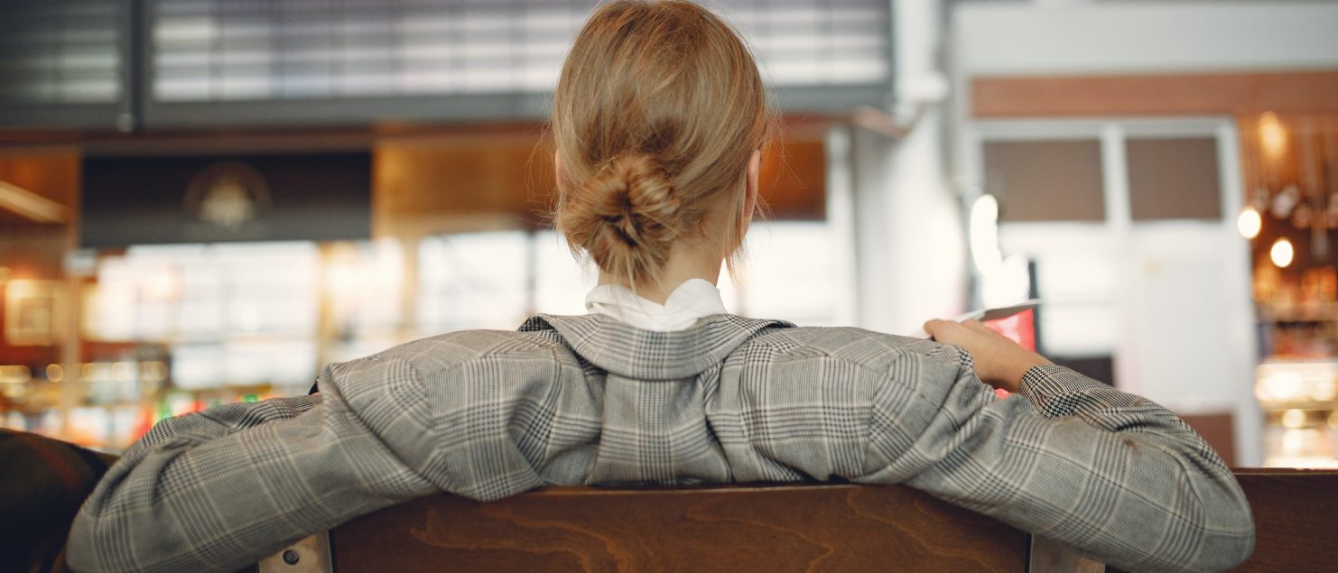 How Airport Lounges Work Woman Sitting In Airports Departures