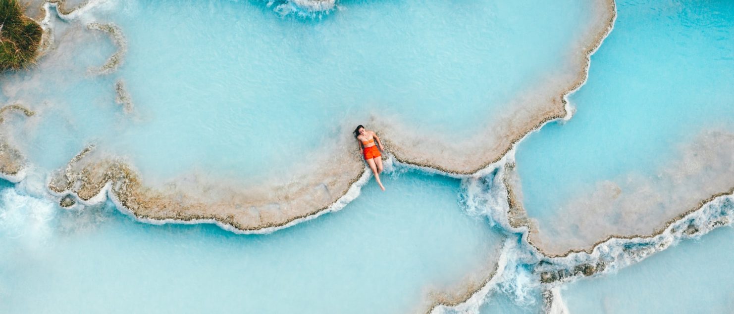 travel smart, woman relaxing in natural pools